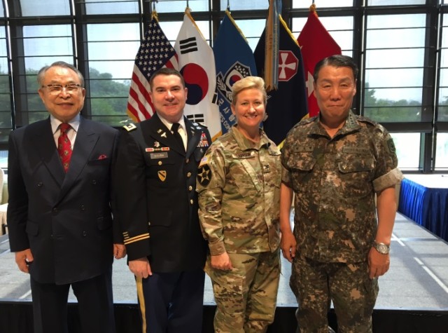 Maj. Steve Scuba poses with distinguished guests