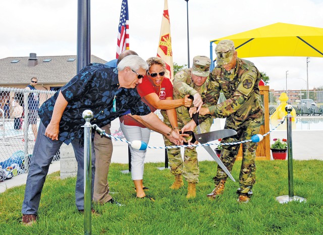 Fort Riley, Kansas, leaders and representatives celebrate the grand opening of the Custer Hill Aquatic Park June 30.