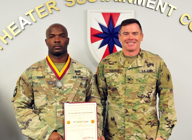 Sgt. First Class David Cooper is presented the Honorable Order of Saint Christopher