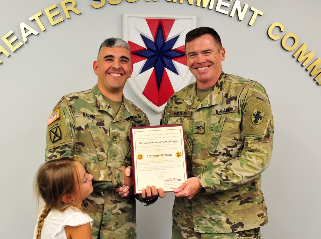 SSG Joseph Harris is presented the Honorable Order of Saint Christopher