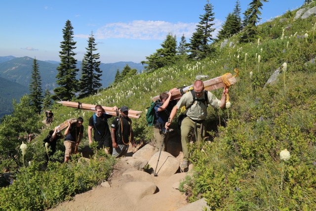 Special Forces Soldiers carry the load for the Forestry Service