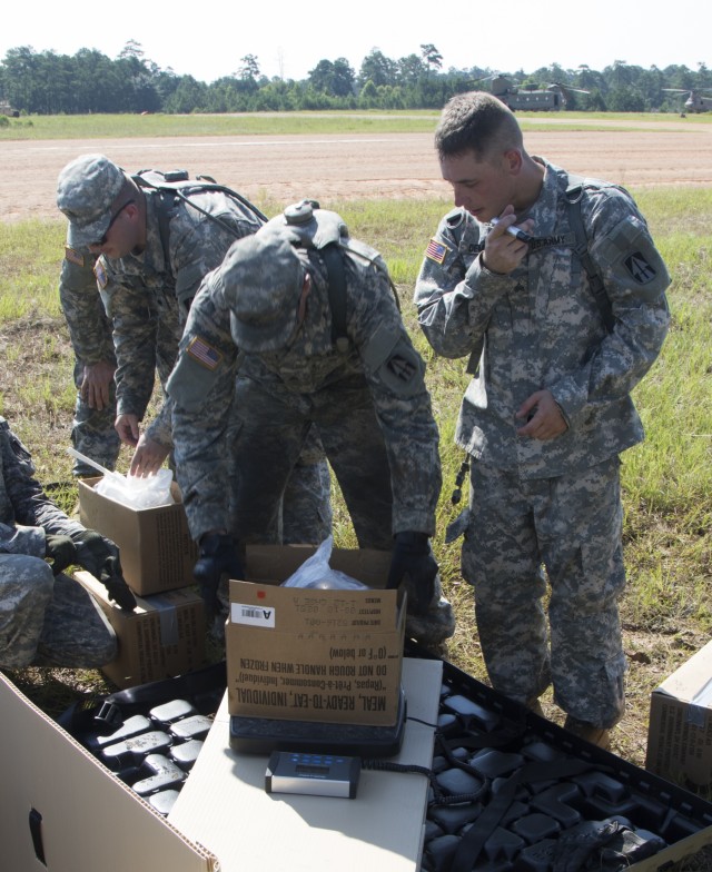 Troops sling load supplies to keep comrades in fight