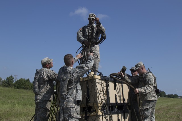 Troops sling load supplies to keep comrades in fight