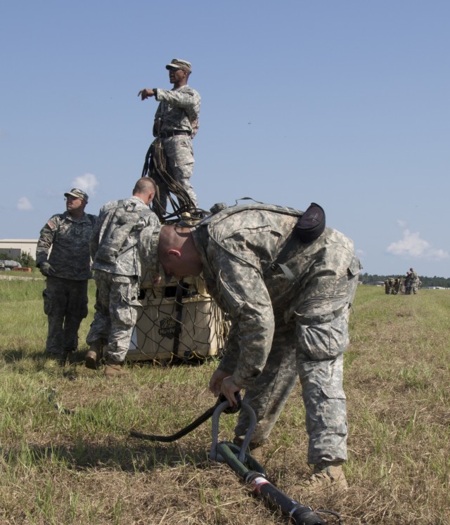 Troops sling load supplies to keep comrades in fight
