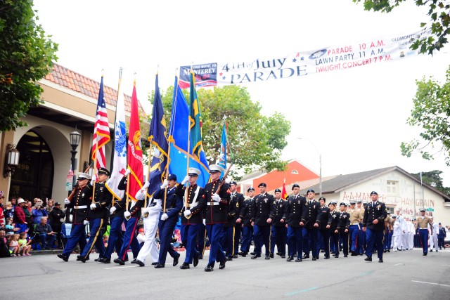 Service Members march in Monterey's Independence Day parade