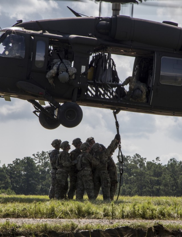 Troops sling load supplies to keep comrades in fight