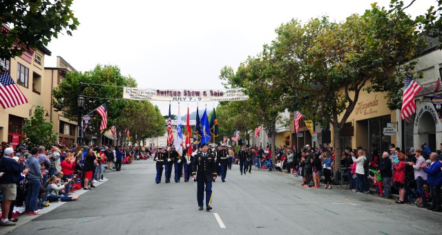Service Members march in Monterey's Independence Day parade