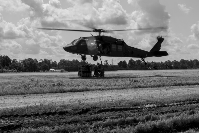Troops sling load supplies to keep comrades in fight