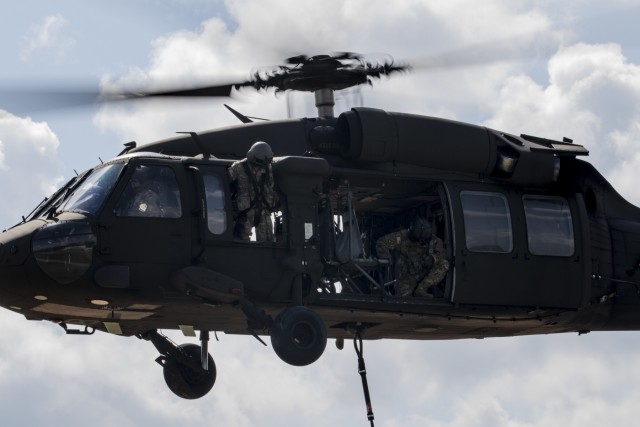 Troops sling load supplies to keep comrades in fight