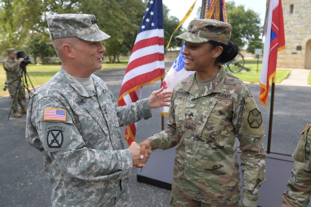 Lt. Gen. Kenneth Dahl congratulates Sgt. Kayanna Johnson