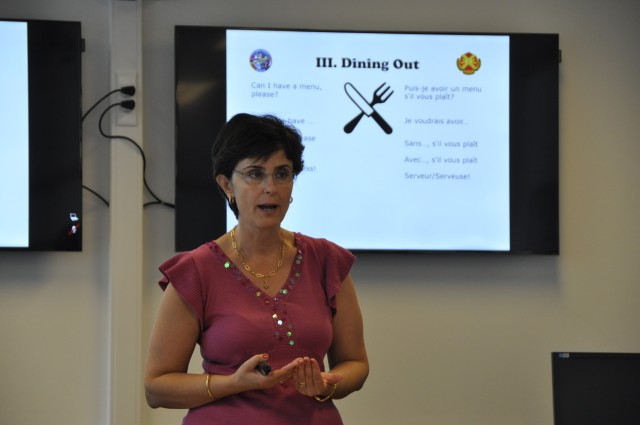 Lindita Celaj teaches newcomes about Belgian dining culture