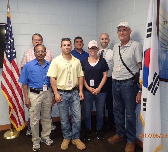Team of engineers peforming inpsection work in South Korea