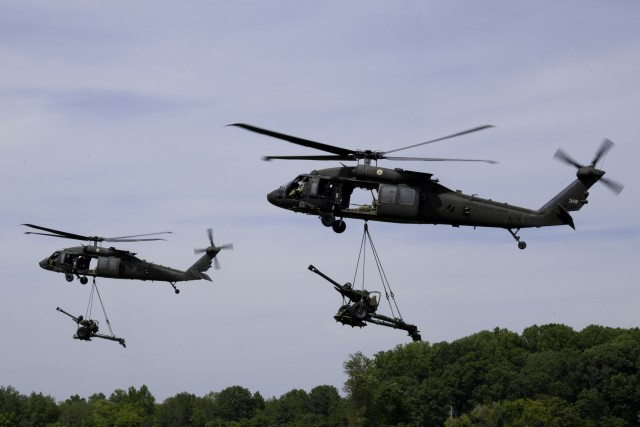 101st Airborne Division (Air Assault) UH-60 Blackhawk helicopters insert M119 Howitzers