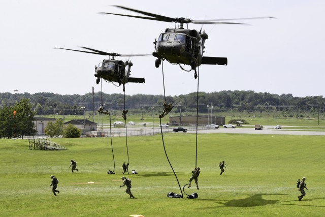 UH-60 Blackhawk helicopters insert Soldiers on Fast Ropes