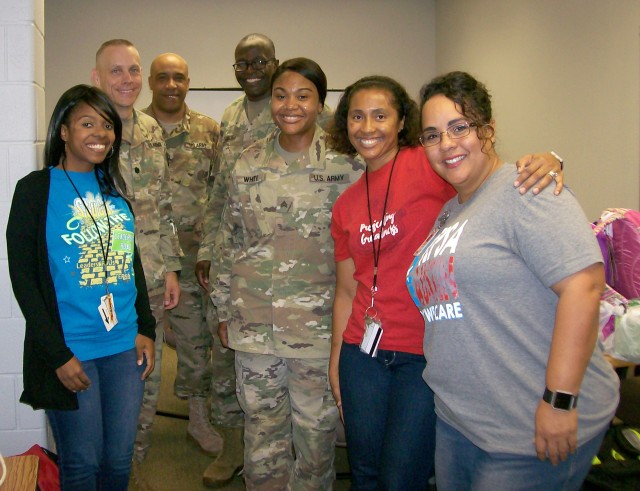 CRDAMC Troop Command donates supplies to adopted school