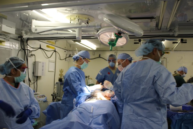 121st CSH Surgeons perform surgery on a patient during MASCAL exercise
