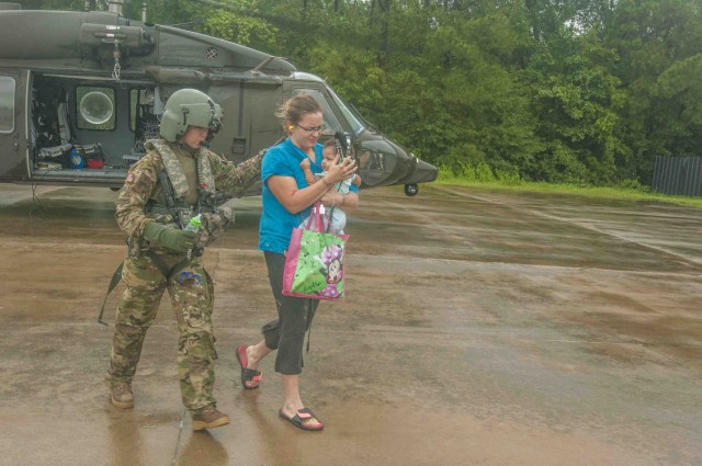 Army Reserve Soldiers helping to rescue residents from Houston's flood waters