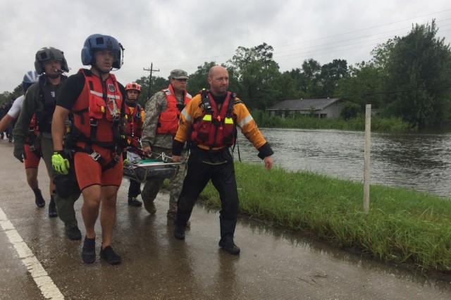 Hybrid team rescues handicapped man from Hurricane Harvey flooding with water, ground and air assets
