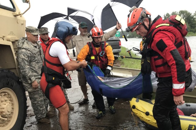 Hybrid team rescues handicapped man from Hurricane Harvey flooding with water, ground and air assets