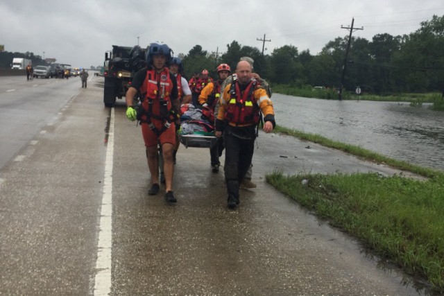 Hybrid team rescues handicapped man from Hurricane Harvey flooding with water, ground and air assets