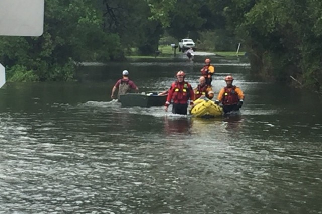 Hybrid team rescues handicapped man from Hurricane Harvey flooding with water, ground and air assets