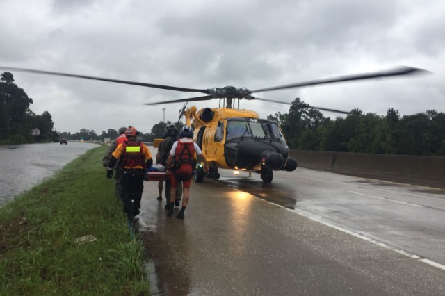 Hybrid team rescues handicapped man from Hurricane Harvey flooding with water, ground and air assets