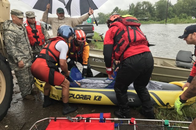Hybrid team rescues handicapped man from Hurricane Harvey flooding with water, ground and air assets