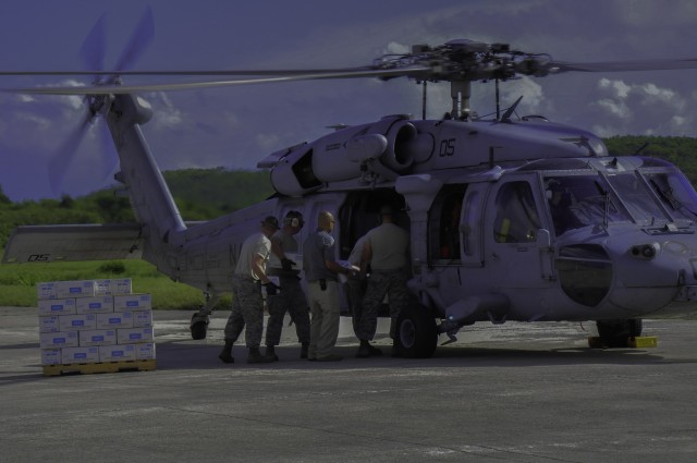 Joint effort moves personnel, cargo to storm victims