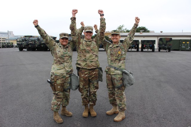 Capt. Erika Rosales and Col. Erica Clarkson congratulate 2nd Lt. Adams Schafer