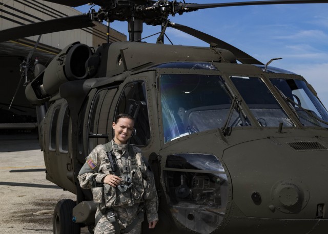 Latina helicopter Guard pilot flying high