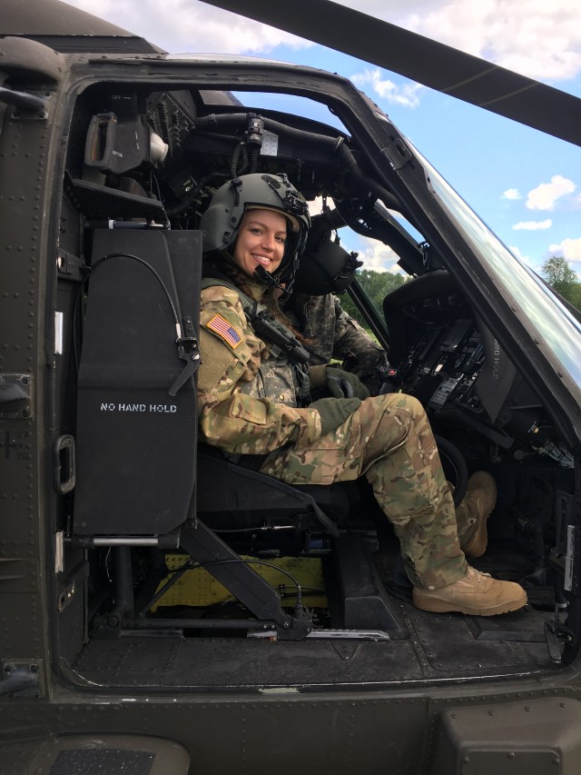Latina helicopter Guard pilot flying high