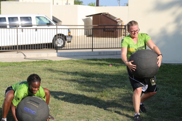 Soldiers attack heavy lifting station during PT Session