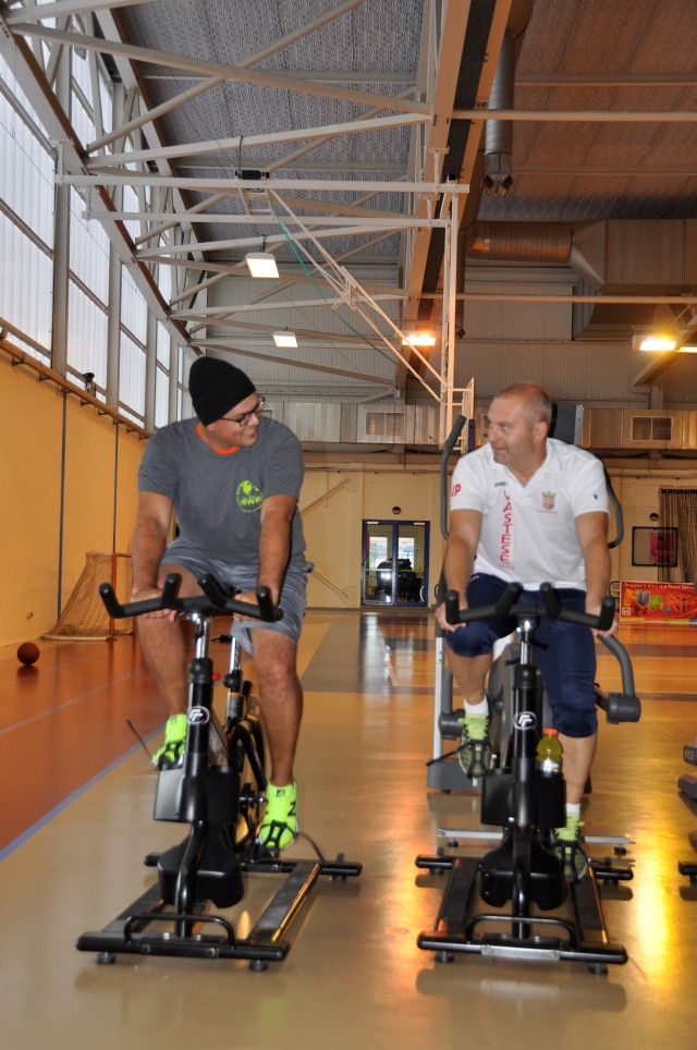 Participants spin during IMCOM Europe Fitness Day