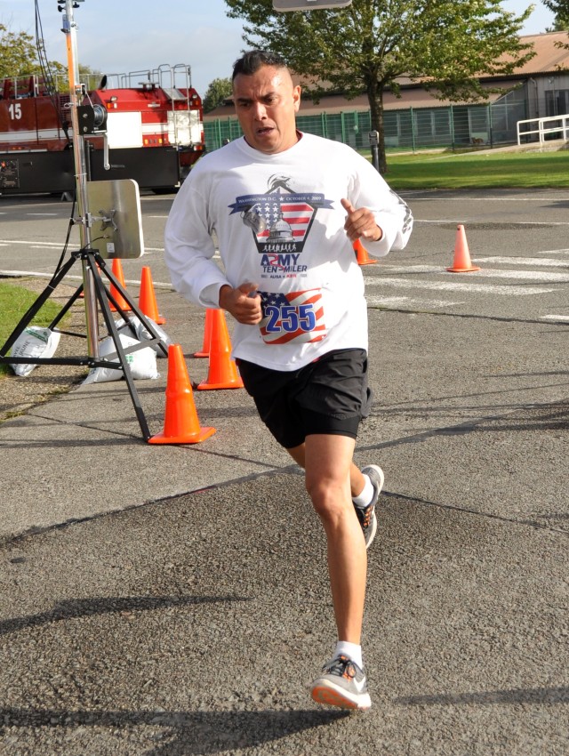 Sgt. 1st Class Leandro Rocha crosses the finish line