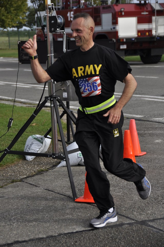 Army Maj. Kevin Daul crosses the Patriot Day Run finish line