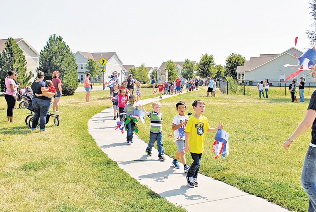 Grade school students at Fort Riley, Kansas, expressed their pride in their parents and country during their annual Freedom Walk Sept. 9.