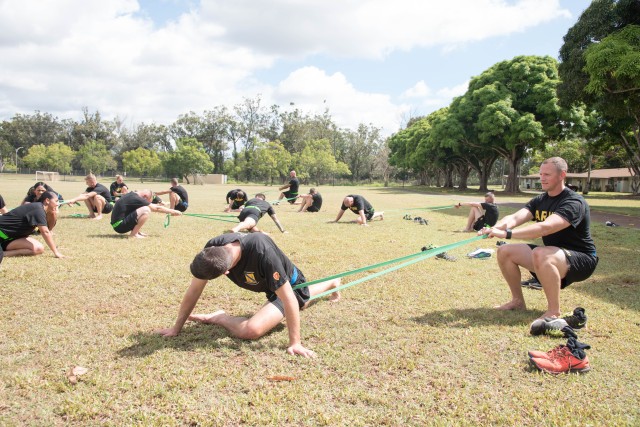 Warrior Brigade Troopers stretch for readiness