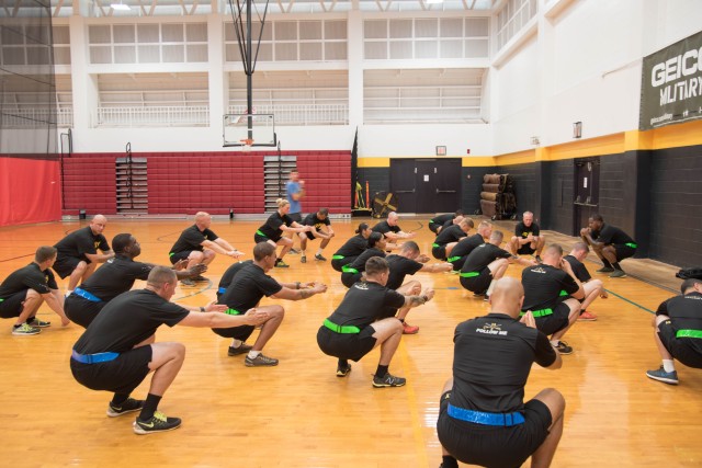 Warrior Brigade Troopers stretch for readiness