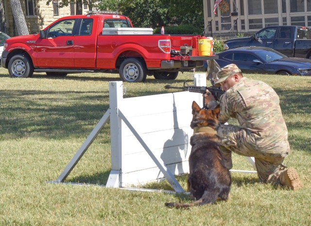 the 523rd Military Working Dog Detachment, 97th Military Police Battalion, Fort Riley, Kansas, did not disappoint as many of over 12,000 patrons watched their demonstration