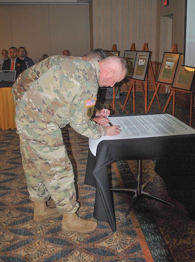 Senior Fort Riley leaders sign a proclamation declaring October as Domestic Violence Awareness Month during the Fort Riley Town Hall Oct. 3 at Riley's Conference Center.