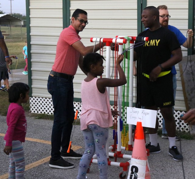 207th Signal soldiers help children's physical training