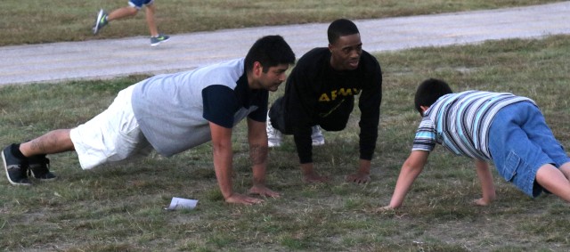 207th Signal soldiers help children's physical training