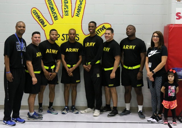 207th Signal soldiers help children's physical training