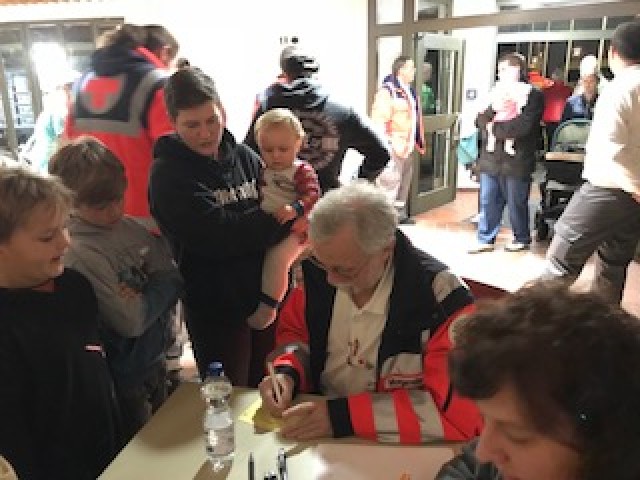 Evacuees arrive at Grafenwoehr's city auditorium amid excavation of WWII-era bomb