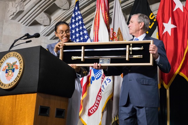 George W. Bush receives cadet saber from West Point First Captain Simone Askew