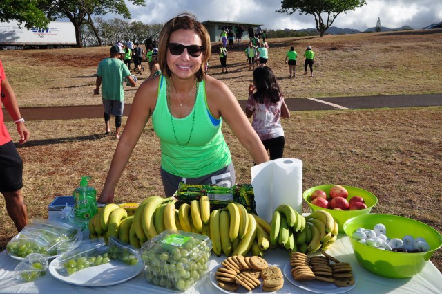 Sgt. 1st Class Sylvia Moreno sets up the refreshments for participants after the Gastroschisis Awareness Day walk/run.
