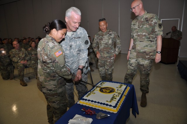 Col. Casey Rogers and Pvt. 2 Jewels Changkaipo, 9th MSC, participate in the traditional cake-cutting ceremony to honor the birth of the Army Reserves.