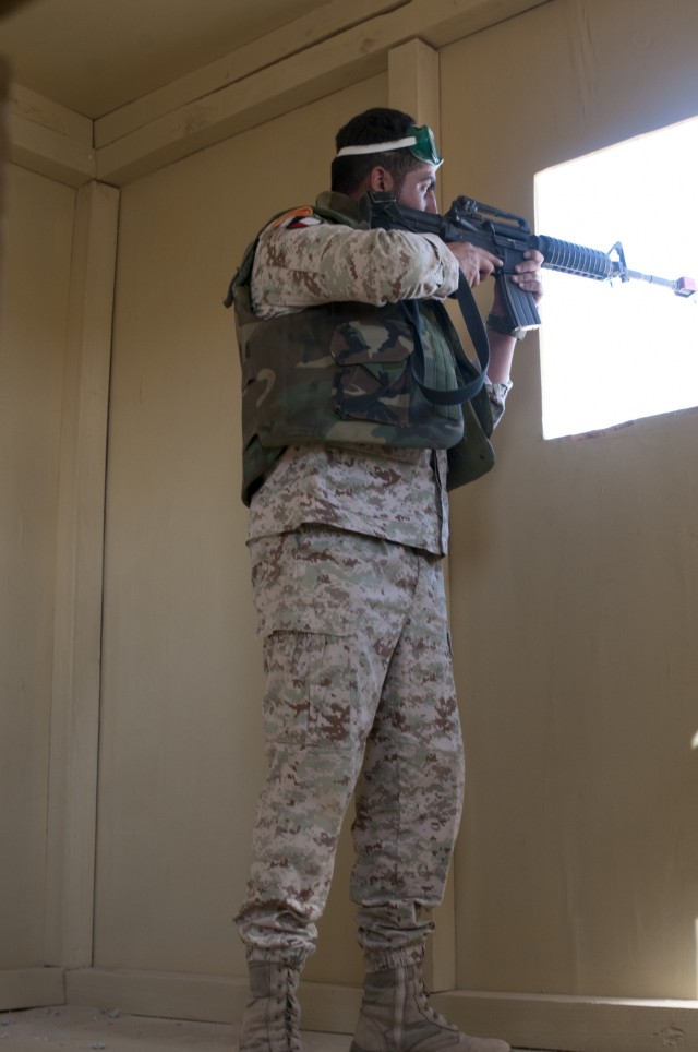 Kuwait Soldier pulls security for U.S Army Soldiers during joint forces training