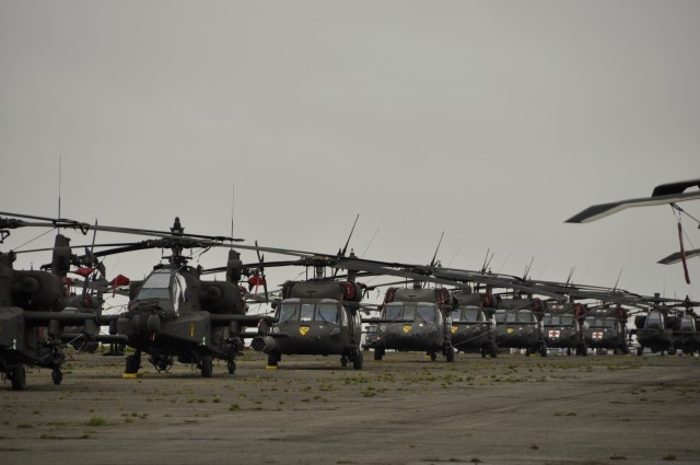 1ACB Helicopters line the Chi&egrave;vres Air Base airfield
