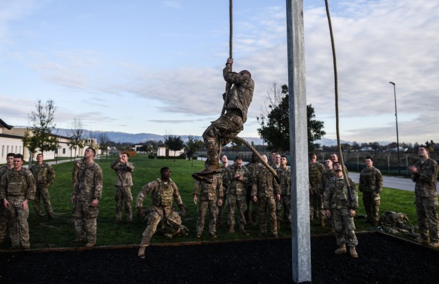 Paratroopers negotiate rope climb during The Brostrom Challenge
